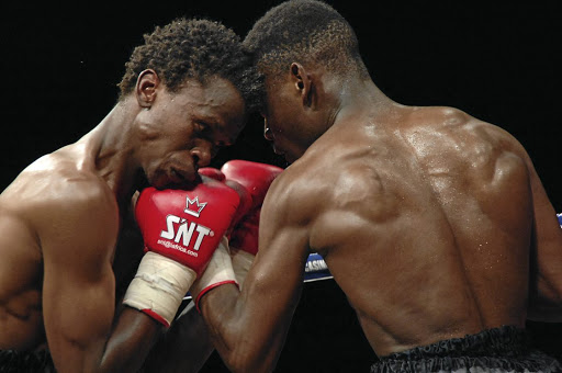 Kgotla Baeti of Botswana, left, punches Ephraim Kabane. Kabasia was always there at the right moment to take a picture.