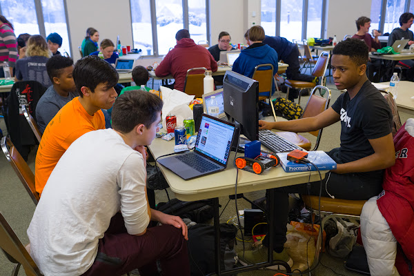 Team of students building a robot