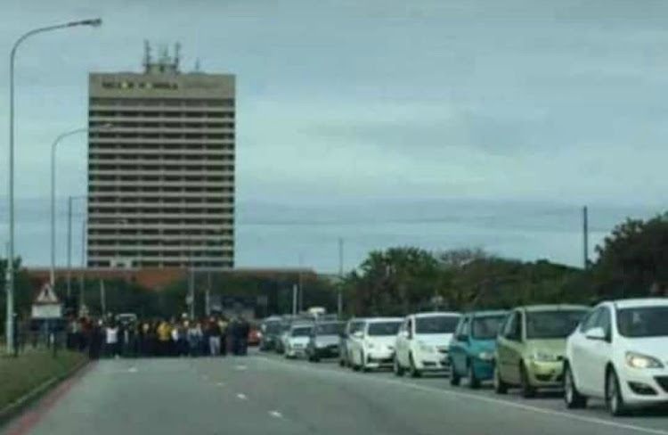 Sasco-aligned protesters block an entrance to the Nelson Mandela University campus in Port Elizabeth on Wednesday.