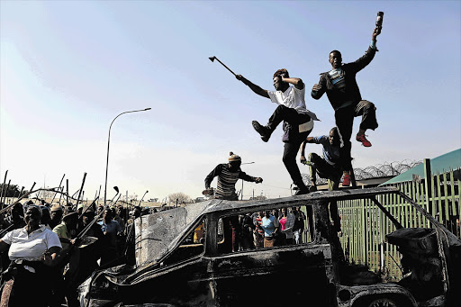 POWER TO THE PEOPLE: Protesters block the Sofasonke and Klipspruit Valley intersection in Orlando East, Soweto after enduring daily electricity cuts. They torched 15 vehicles