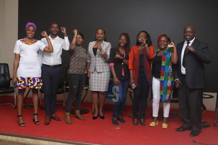 Defender's Coalition activists for human rights network do a solidarity chant during the commemoration of International Women's day at a Nairobi hotel on March 8, 2023.