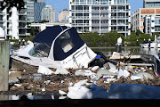 Boats and other debris are seen washed into Hawthorne ferry terminal by the force of floodwaters following heavy rains in Brisbane, Queensland, Australia March 2, 2022. 