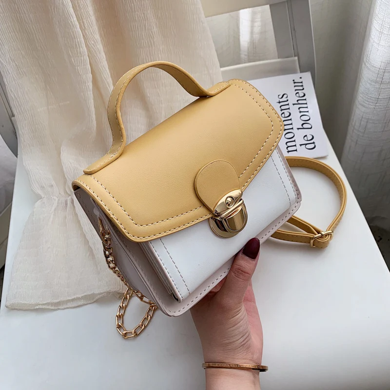 Bolsa de ombro feminina com contraste de cores. Design moderno e funcional. Perfeita para o dia a dia e eventos, combine com seus looks e estilos