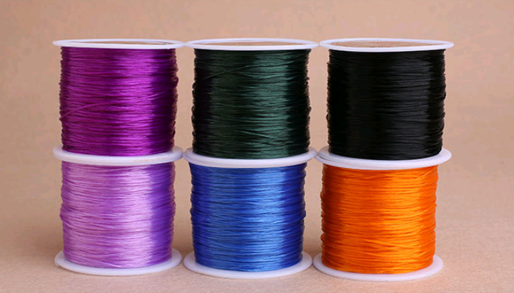 Fil élastique coloré pour bracelets de perles, fil de verre, fil de pêche. Créez des bijoux uniques et résistants avec ce fil polyvalent.