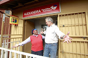 Post Office CEO Mark Barnes with staffer Gloria Malatji during a visit to branches in Alexandra.