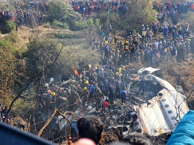 Rescue teams work to retrieve bodies after a passenger aircraft crashed in Pokhara in Nepal, on January 15 2023. Picture: NARESH GIRI/SOCIAL MEDIA/REUTERS