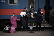 Children arrive at the train station in Zahony, Ukraine, as people continue to flee. More than a million refugees have poured into neighbouring countries since Russia launched a large-scale attack on Ukraine.