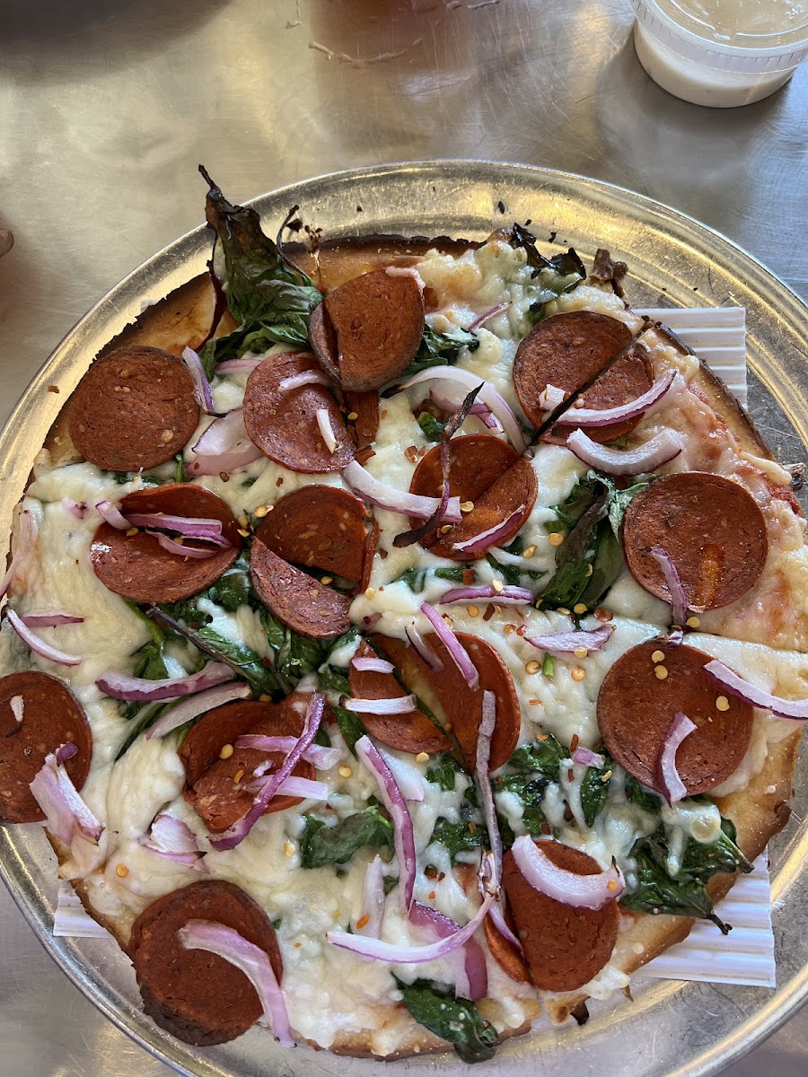 Gluten free crust with vegan cheese, spinach, red onion, red pepper flakes and vegan pepperoni.
