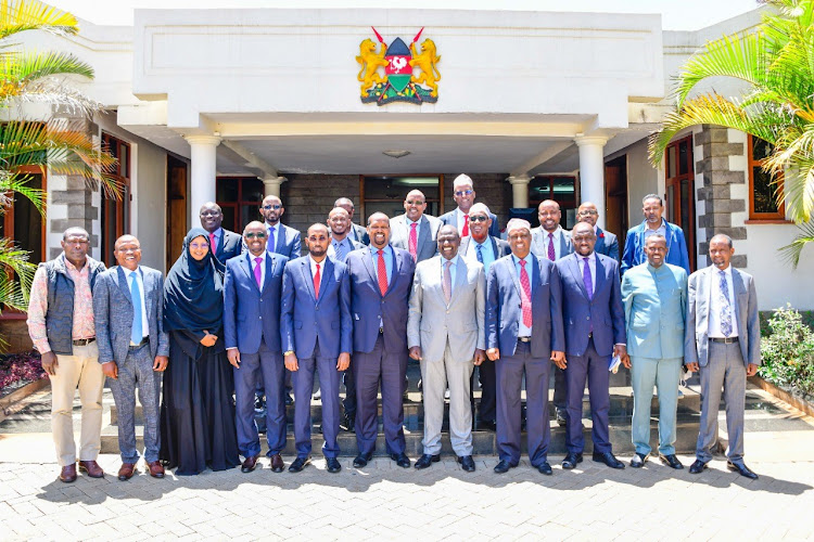 President elect William Ruto poses for a group photo with UDM party leaders led by Mandera senator elect Ali Roba at his karen residence when they joined the kenya kwanza coalition.