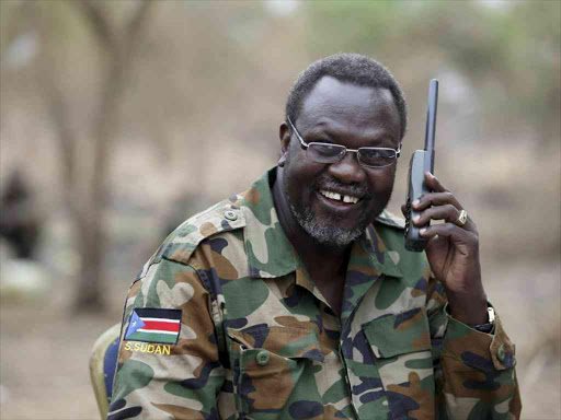 outh Sudan's rebel leader Riek Machar talks on the phone in his field office in a rebel-controlled territory in Jonglei State, South Sudan, February 1, 2014. /Reuters