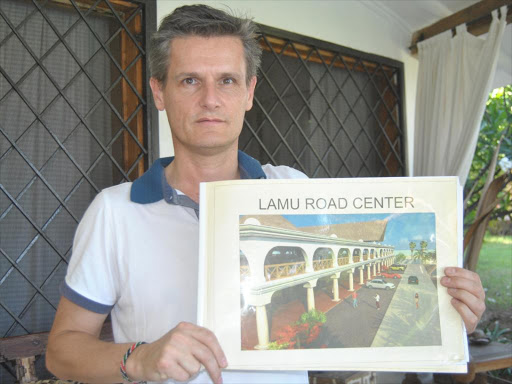 Luca Rizzato, a director of Alirima point limited shows the plan of the development called project Lamu road centre in Kwandomo Magarini that will cost Sh. 200 million. The intended land for the project was invaded by squatters after hearing complaints of land on December 15.