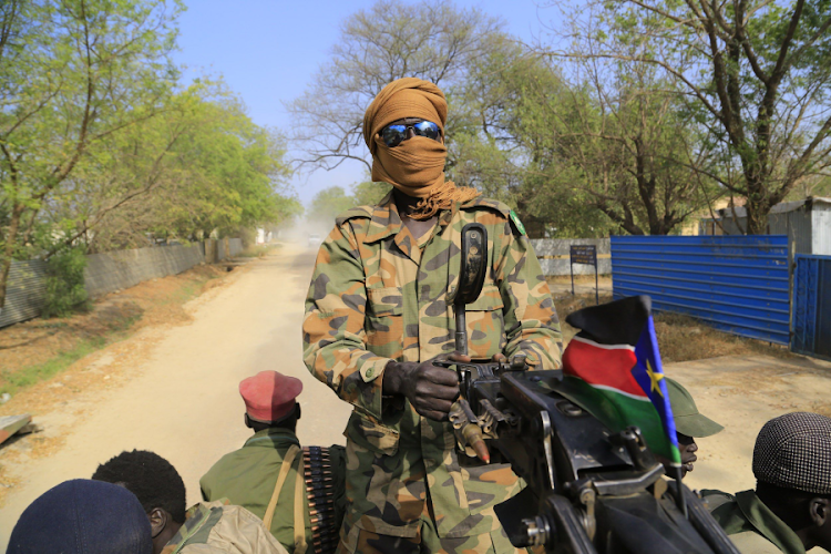 A South Sudan army soldier mans a machine gun mounted on a truck. Picture: RETUERS