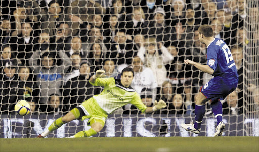 Stevenage's Joel Byrom scores from the penalty spot in the fourth minute against Tottenham Hotspur in their English FA Cup fifth-round replay at White Hart Lane last night. Spurs bounced back to win 3-1 Picture: EDDIE KEOGH/REUTERS