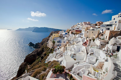 Captivating sugar-cube buildings line the cliffs of Oia on Santorini, Greece — one of the great views in the world. 