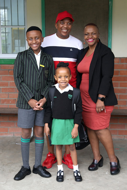 Afezwa Cembi (11) with his sister, Othasive (6) and parents Elvis and Gidz on the first day of school at Cambridge Primary School, East London.