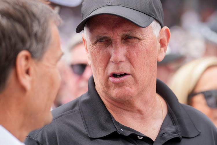 May 28, 2023; Indianapolis, Indiana, USA; Former Vice President Mike Pence walks through pit lane Sunday, May 28, 2023, before the 107th running of the Indianapolis 500 at Indianapolis Motor Speedway.