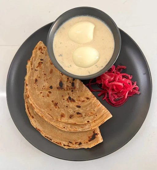 Malai Egg With Lachha Paratha And Onion Salad