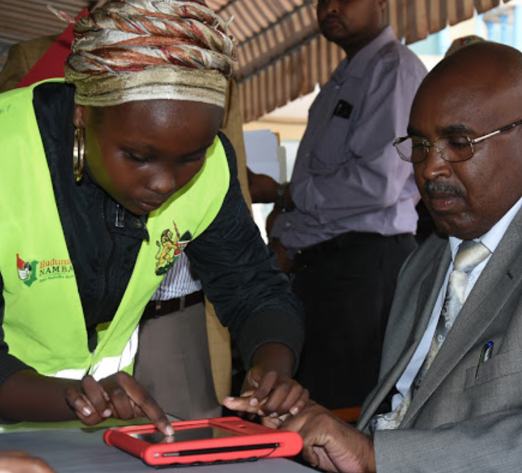 MKU Chairman Dr Simon Gicharu registers for the Huduma Namba at the institution in Thika on Thursday