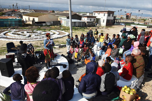 Khayelitsha residents and supporters at the launch of the Ujamaa guerilla gardening project next to the Khayelitsha Football for Hope Centre. Photos: Christine Hogg