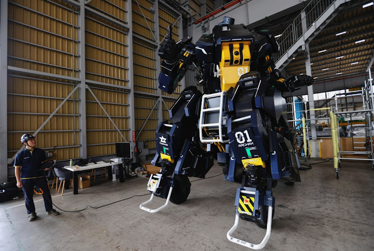 CEO Ryo Yoshida and CTO Akinori Ishii (inside the cockpit) demonstrate ARCHAX, a giant human-piloted robot developed by their start-up Tsubame Industries, in Yokohama, south of Tokyo, Japan, on September 27 2023. Picture: REUTERS/ISSEI KATO