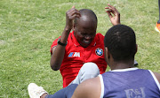  A potential recruit closes his eyes as he tries to finish a sit up during a fitness test. 