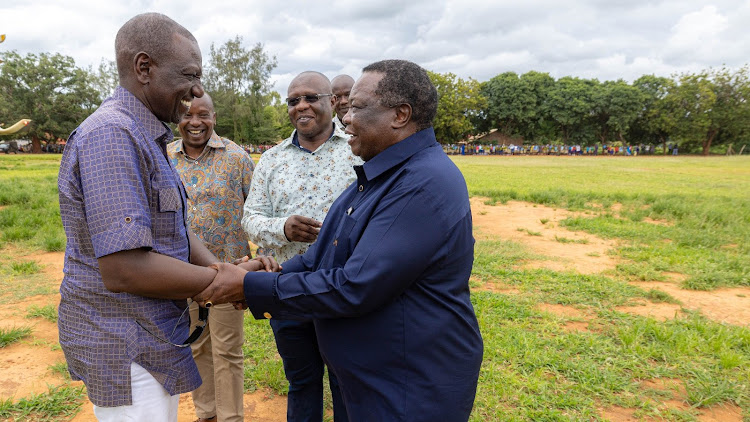 President William Ruto greeting COTU chairperson Francis Atwoli at St Thomas Girls’ School in Kilifi during the opening of the school's complex on July 28, 2023.