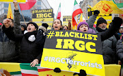 People rally against Iranian regime during a European Union (EU) Foreign Affairs council in Brussels, Belgium January 23, 2023. 