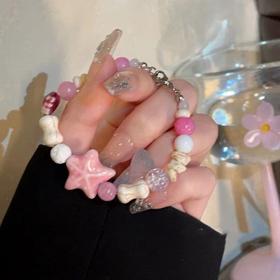 Bracelet macaron doux en forme d'étoile de mer pour femmes, design spécial. Un accessoire charmant et unique pour un style élégant et original.