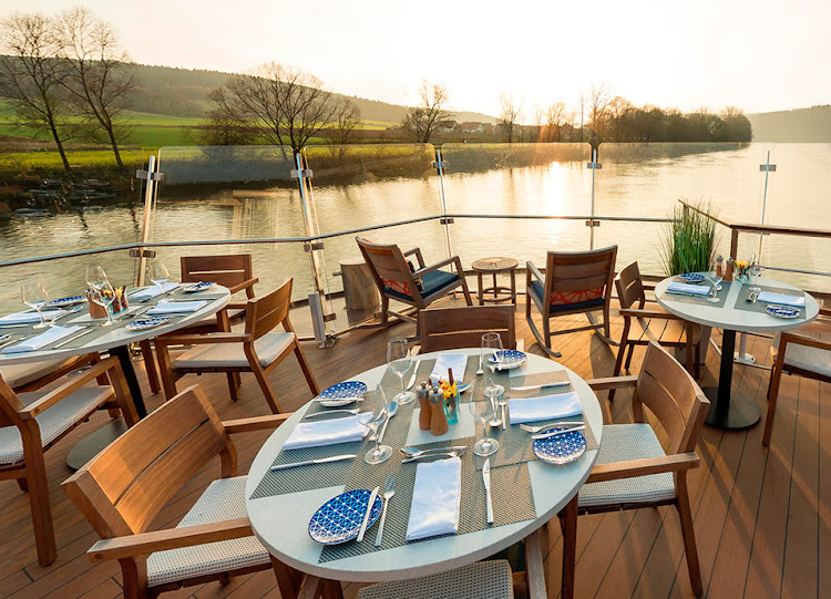 Dine outside and take in sweeping river views at the Aquavit Terrace on your Viking Longship. 