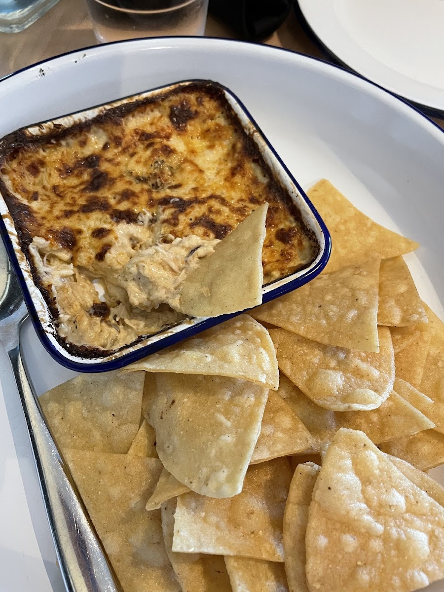 Hot crab dip with corn chips.