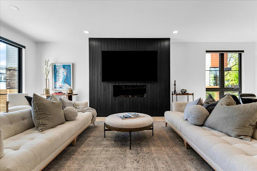 Modern living room with sofas and wall-mounted TV - Buy this luxury house in Birmingham, 4 bedrooms