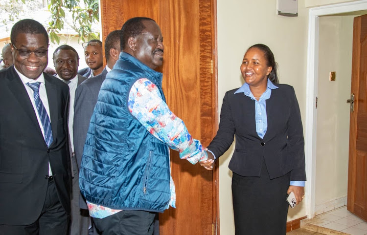 ODM leader Raila Odinga greet Samburu West MP Naisula Lesuuda during a meeting at the SKM Centre in Karen on Tuesday, November 29, 2022.