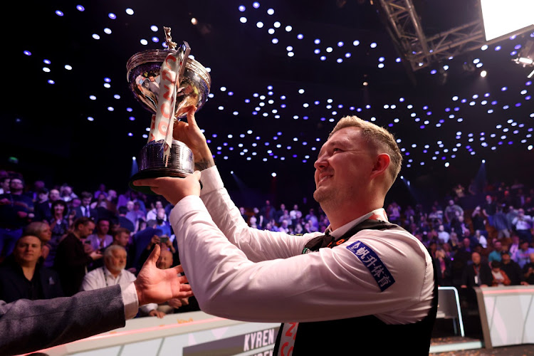 Kyren Wilson of England celebrates with the Cazoo World Snooker Championship trophy in Sheffield, England. Picture: GEORGE WOOD/GETTY IMAGES