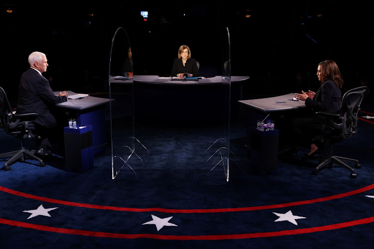 U.S. Vice President Mike Pence and Democratic vice presidential nominee and U.S. Senator Kamala Harris take part in the 2020 vice presidential debate moderated by Susan Page of USA Today, on the campus of the University of Utah in Salt Lake City, Utah, U.S., October 7, 2020. Justin Sullivan/Pool via REUTERS