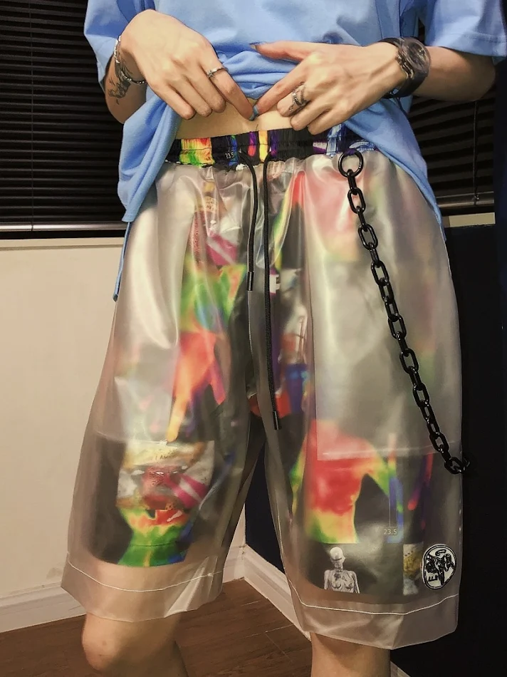 Short d'été européen et américain street grotesque à coutures, transparents, faux deux shorts, hip hop, larges et élégants, pantalon cinq pièces tendance.
