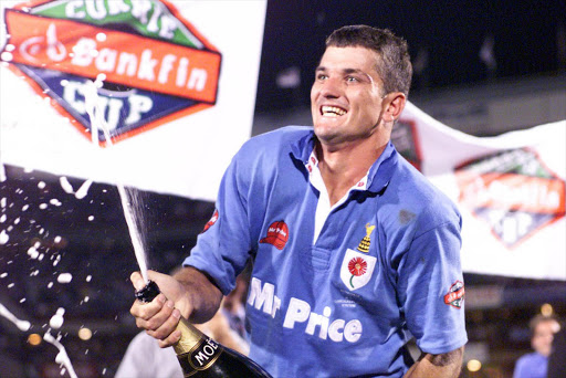 Joost van der Westhuizen sprays the champagne after the Currie Cup final match between Blue Bulls (24) and Western Province (20) at Loftus Versfeld on October 31, 1998 in Pretoria.