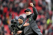 Liverpool manager Jurgen Klopp acknowledges the fans after the Premier League draw against Manchester United at Old Trafford on April 7, 2024 in Manchester