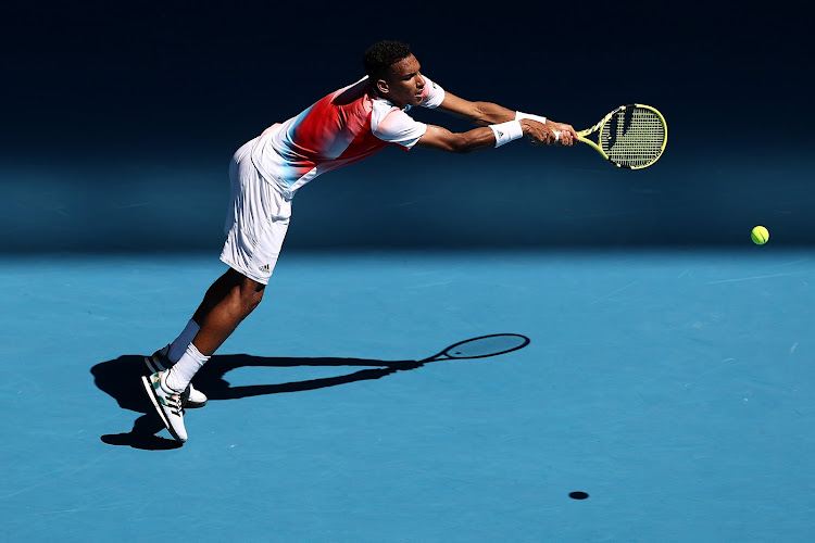 Felix Auger-Aliassime in action against Marin Cilic.