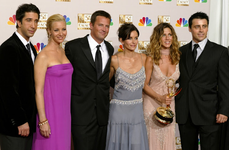 David Schwimmer, Lisa Kudrow, Matthew Perry, Courteney Cox Arquette, Jennifer Aniston and Matt LeBlanc of "Friends" appear in the photo room at the 54th annual Emmy Awards in Los Angeles, US, on September 22 2002. Perry found dead on Saturday aged 54. File photo.