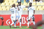 Justin Shonga celebrates with Innocent Maela and Luvuyo Memela of Orlando Pirates during the Absa Premiership match between Platinum Stars and Orlando Pirates at Royal Bafokeng Stadium on January 27, 2018 in Rustenburg, South Africa.
