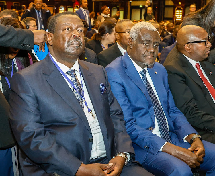 Prime cabinet secretary Musalia Mudavadi with AU chairman Moussa Faki and other participants during the G20 CwA conference in Berlin, Germany on November 20, 2023.