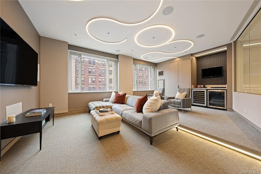 Luxury house for sale in New York (United States) - Modern living room with comfortable grey sofa