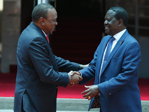 President Uhuru Kenyatta and ODM leader Raila Odinga shake hands at Harambee House on March 9, 2019.