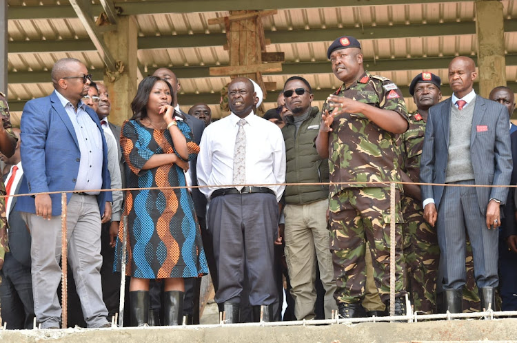 Deputy President Rigathin Gachagua with Sport cabinet secretary Ababu Namwamba and Housing Principal Secretary Charles Hinga at Embu stadium on April 12, 2023.