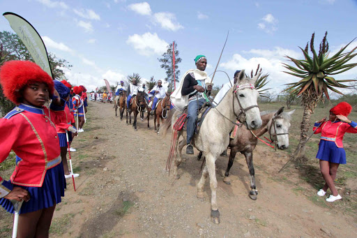 TAKING THE SALUTE: Showcasing OR Tambo District cultural tourism, drum majorettes from Zimele High School form a guard of honour as horses and traditional singers and dancers pass during the launch of Tourism Month by Eastern Cape Parks and Tourism Agency and OR Tambo District municipality at Ndulini Nature Reserve in Mthatha on Tuesday Picture: LULAMILE FENI