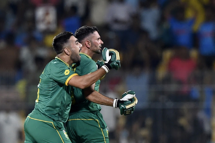 South Africa's Keshav Maharaj (right) and Tabraiz Shamsi celebrate after South Africa win the match by 1 wicket.