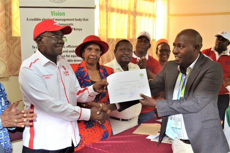 David Musila receives the clarence certificated by the Kitui county returning officer Macharia Gichichi on Tuesday.