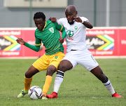 Siyabonga Khumalo of Golden Arrows and Makhehleni Makhaula of AmaZulu challenge for possession during the DStv Premiership 2021/22 football match between Golden Arrows and AmaZulu.