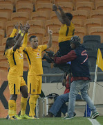 Kaizer Chiefs players celebrate with Siphiwe Tshabalala of Kaizer Chiefs after scoring a goal during the Absa Premiership match between Kaizer Chiefs and Bidvest Wits at FNB Stadium on September 16, 2017 in Johannesburg, South Africa.