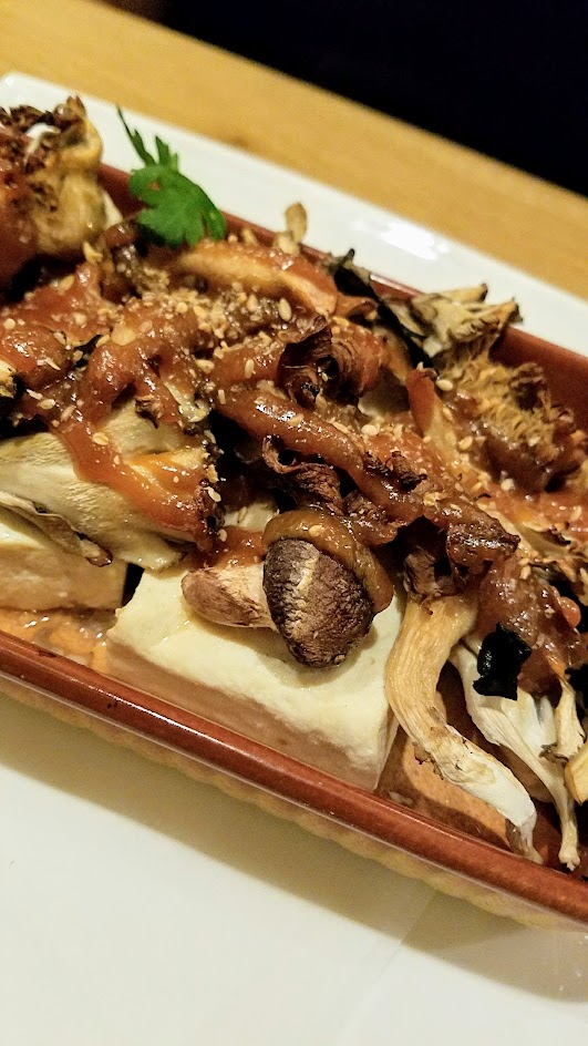 Chef Naoko's Shizuku hot small plate during dinner of vegan Miso Glazed Ota Tofu with Oregon Mushrooms, one of half a dozen hot small plates available